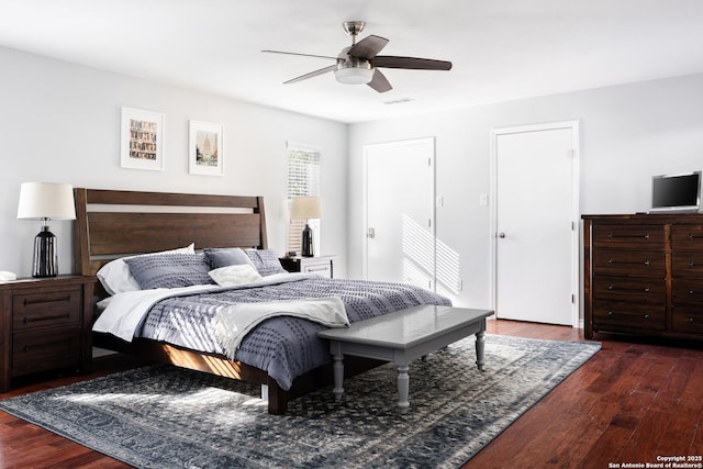 bedroom featuring visible vents, ceiling fan, and wood finished floors