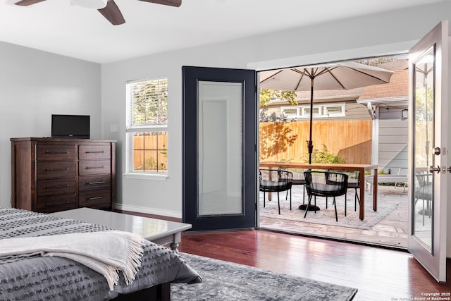 bedroom featuring wood finished floors and baseboards