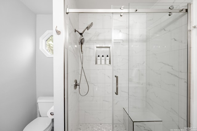 full bath with toilet and a marble finish shower