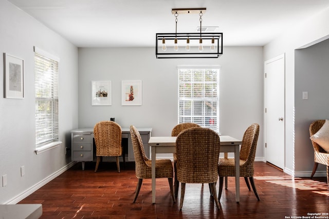 dining room with dark wood-style floors and baseboards