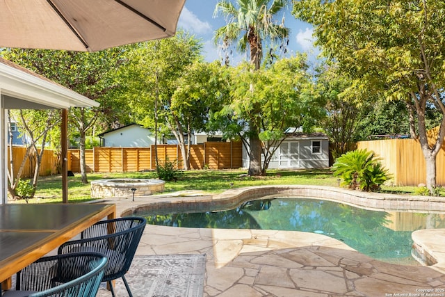 view of pool featuring a fenced in pool, an outdoor structure, a fenced backyard, and a hot tub