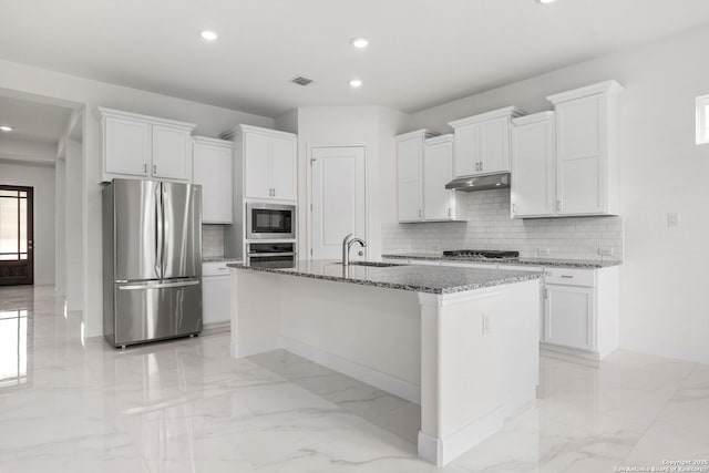 kitchen featuring appliances with stainless steel finishes, a sink, marble finish floor, and under cabinet range hood