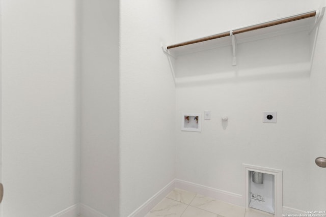 washroom with washer hookup, hookup for a gas dryer, electric dryer hookup, baseboards, and laundry area