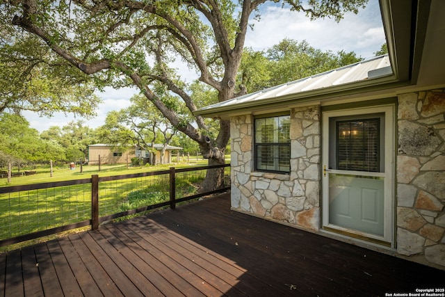 deck featuring a lawn