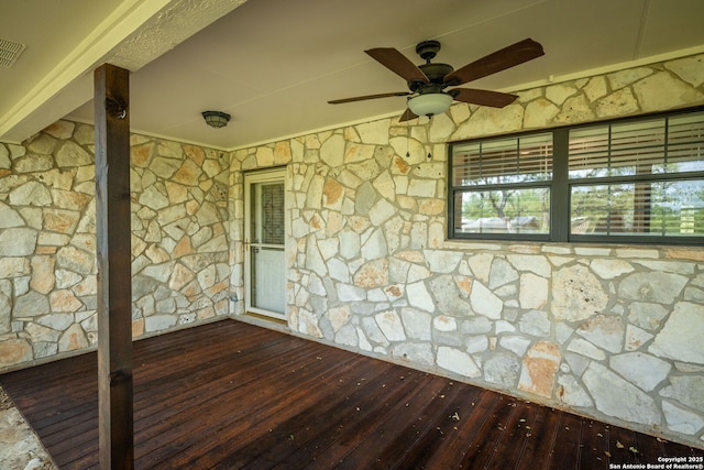 wooden deck featuring a ceiling fan