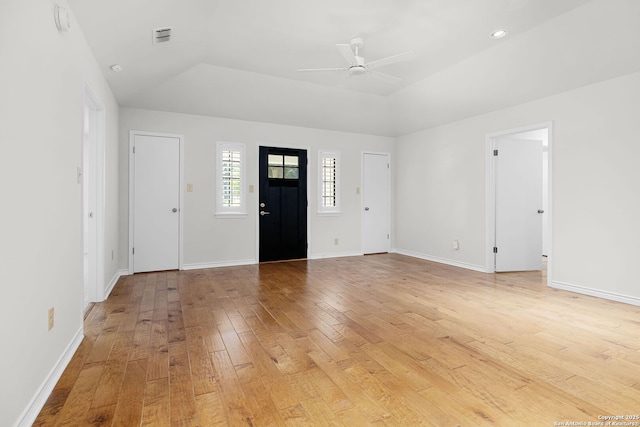 entrance foyer with visible vents, a ceiling fan, light wood-style flooring, and baseboards