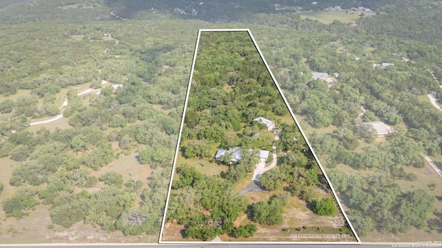 aerial view featuring a view of trees