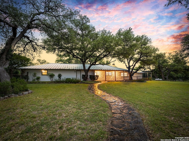 276 Eden Rnch, Canyon Lake, TX 78133 - yard at dusk with a lawn