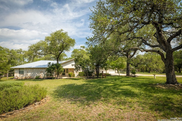 view of yard featuring a garage
