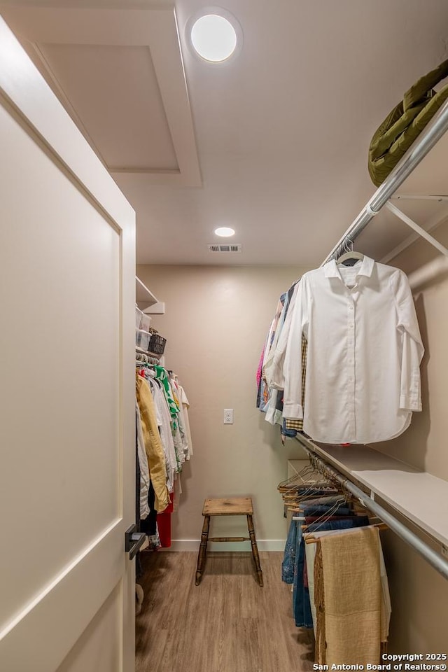 spacious closet with wood finished floors