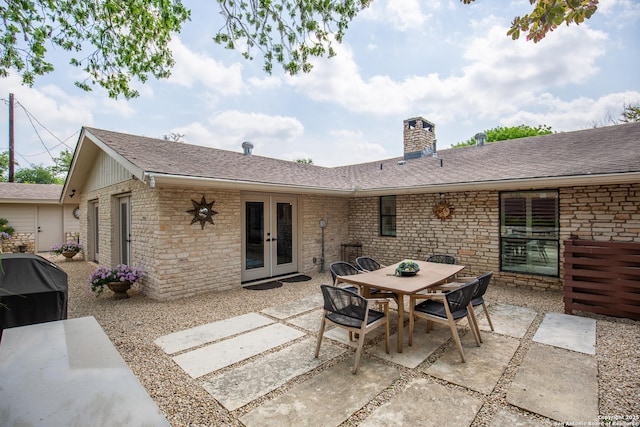 view of patio with french doors and outdoor dining space