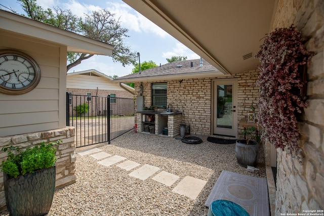 view of patio / terrace featuring fence