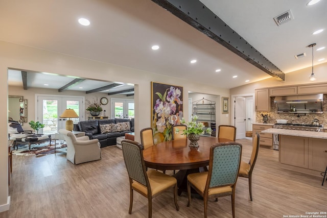 dining space featuring visible vents, recessed lighting, vaulted ceiling with beams, and light wood-style flooring