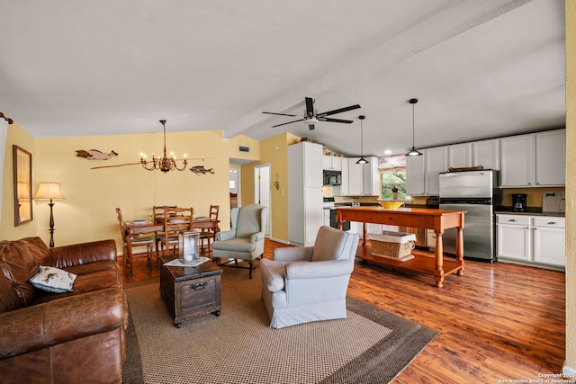 living area featuring wood finished floors, lofted ceiling with beams, visible vents, and ceiling fan with notable chandelier