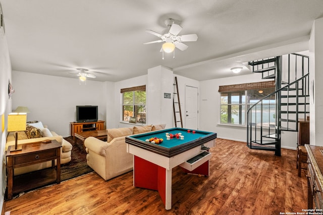 game room featuring a ceiling fan and wood finished floors