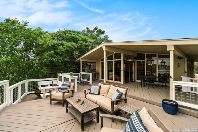 deck with outdoor lounge area, area for grilling, and outdoor dining space