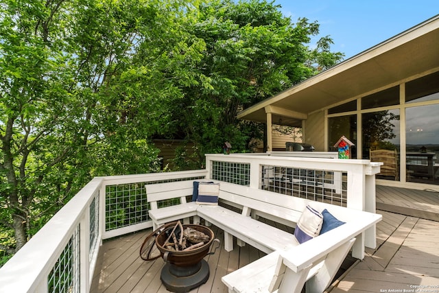 deck featuring a fire pit