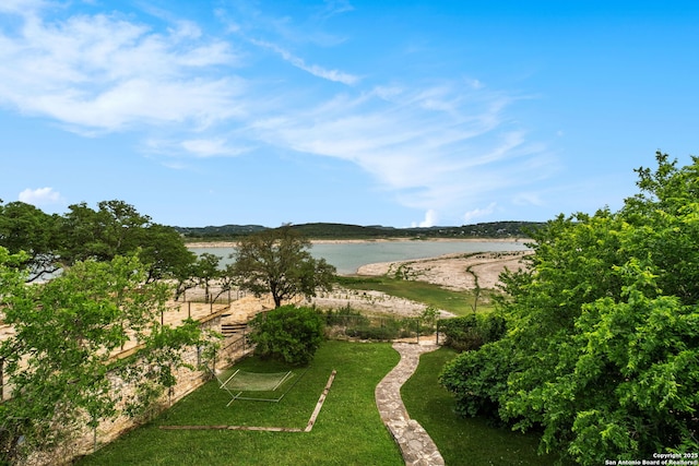 view of community with a water view