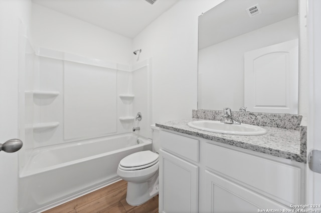 full bath with wood finished floors, toilet, shower / tub combination, vanity, and visible vents