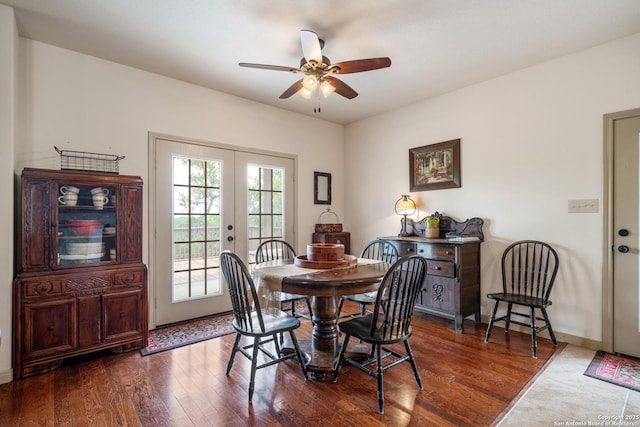 dining room with baseboards, dark wood-style flooring, ceiling fan, and french doors
