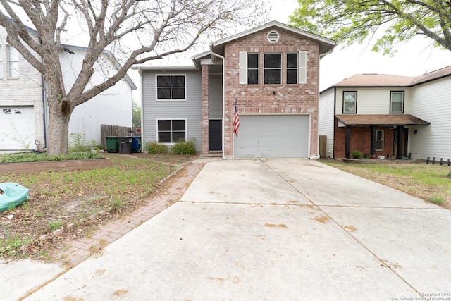 traditional home with concrete driveway, an attached garage, and brick siding