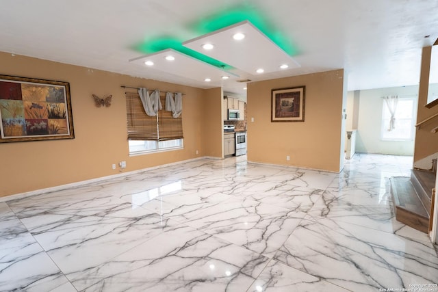 unfurnished living room with recessed lighting, baseboards, marble finish floor, and stairs