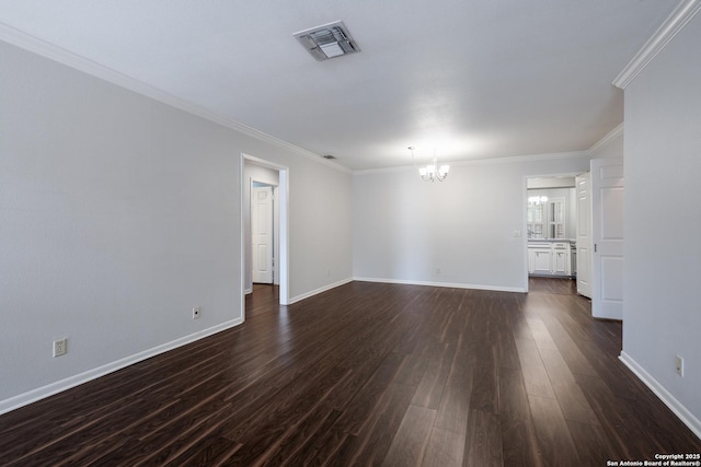 unfurnished living room with crown molding, visible vents, baseboards, dark wood-type flooring, and a notable chandelier