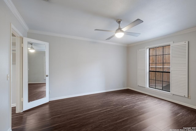 spare room featuring baseboards, ceiling fan, dark wood-style flooring, and crown molding