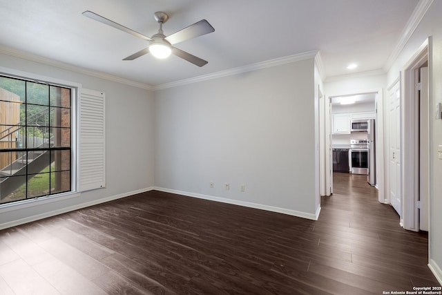 spare room featuring baseboards, ceiling fan, dark wood-style flooring, and crown molding