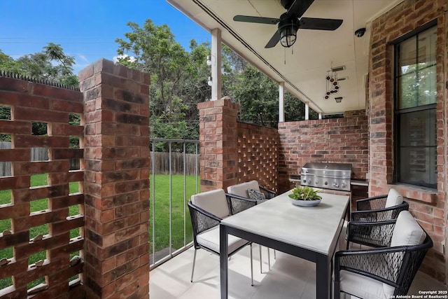 view of patio / terrace featuring outdoor dining space, ceiling fan, grilling area, and fence