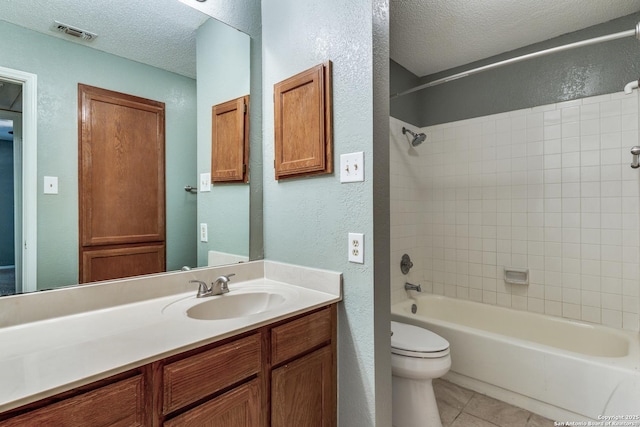 full bath with a textured ceiling, visible vents, a textured wall, tile patterned floors, and bathtub / shower combination