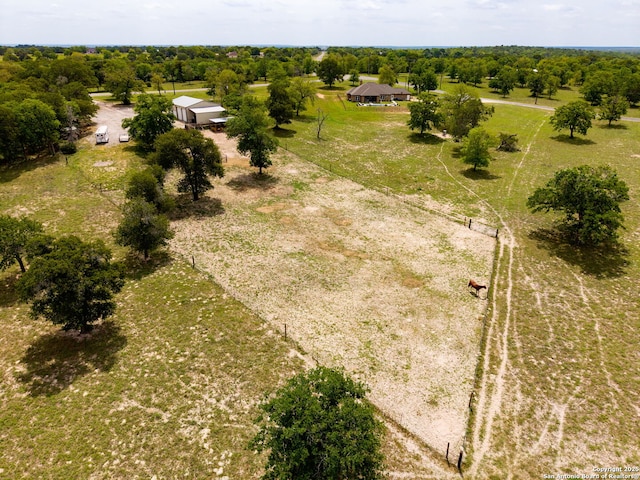 birds eye view of property with a rural view