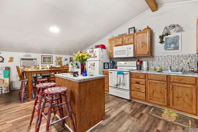 kitchen featuring lofted ceiling with beams, a center island, dark wood finished floors, and white appliances