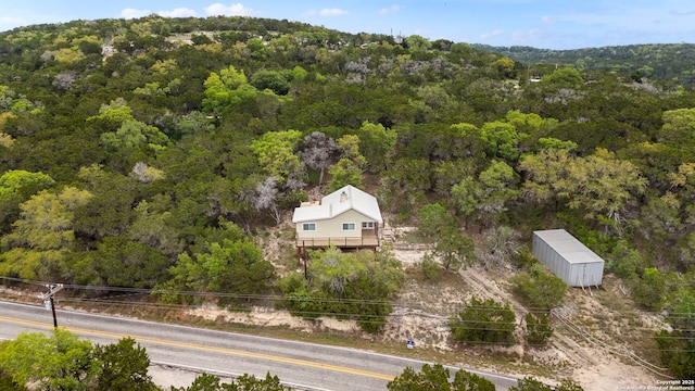 drone / aerial view with a view of trees