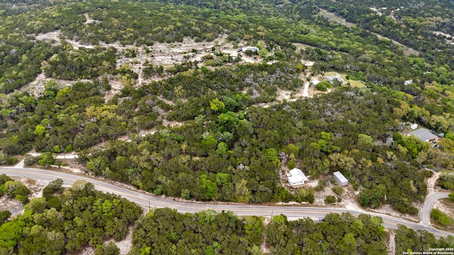 birds eye view of property with a wooded view