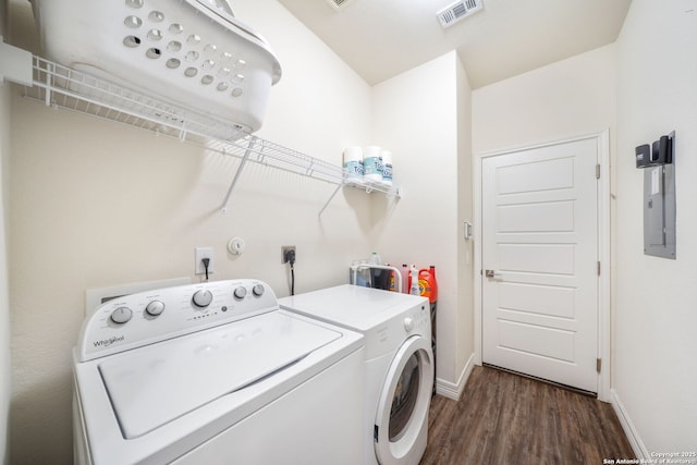 laundry room featuring independent washer and dryer, visible vents, dark wood-style floors, baseboards, and laundry area