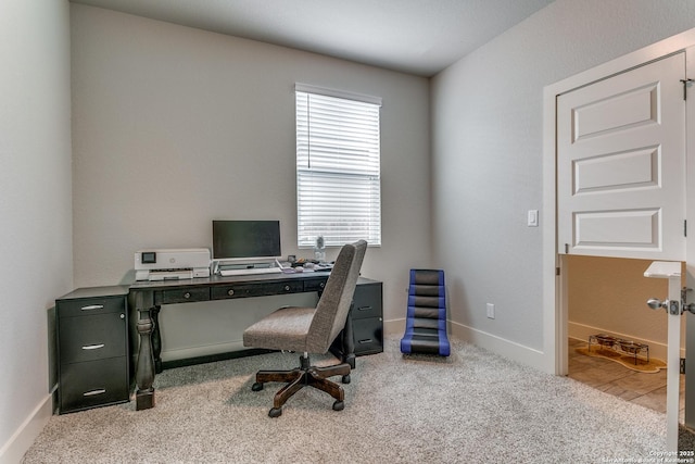 office space with baseboards and carpet