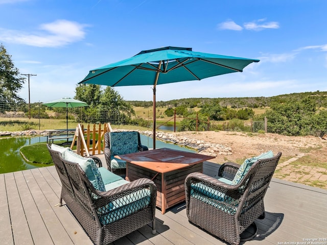 11890 Ranch Road 965, Fredericksburg, TX 78624 - wooden deck with an outdoor living space and a water view