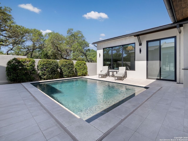 view of pool with a fenced backyard, a patio area, and a fenced in pool