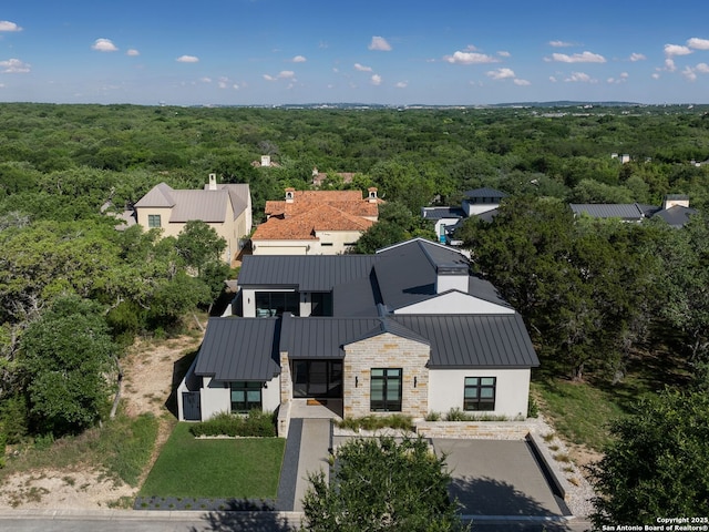 aerial view with a wooded view