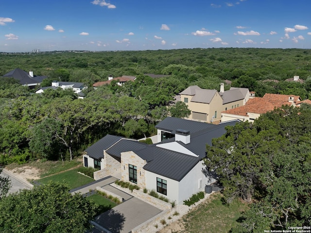 bird's eye view featuring a forest view