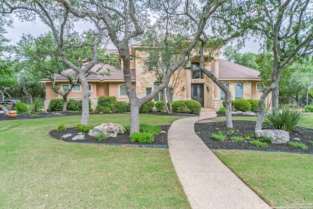 831 Fawnway, San Antonio, TX 78260 - townhome / multi-family property with stucco siding, a front lawn, and stone siding