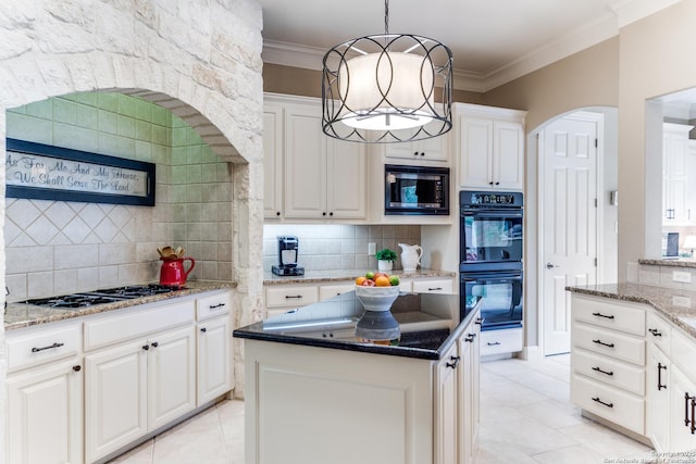 831 Fawnway, San Antonio, TX 78260 - kitchen featuring built in microwave, arched walkways, backsplash, and dobule oven black