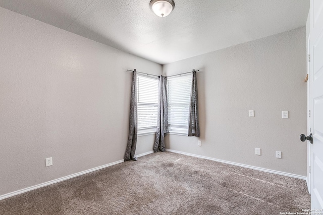 507 Lovera, San Antonio, TX 78212 - unfurnished room with baseboards, a textured ceiling, carpet, and a textured wall
