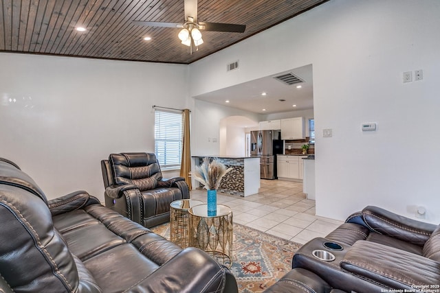 507 Lovera, San Antonio, TX 78212 - living area featuring arched walkways, visible vents, a ceiling fan, light tile patterned flooring, and high vaulted ceiling