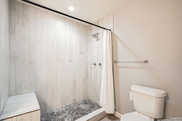full bath with a shower stall and toilet
