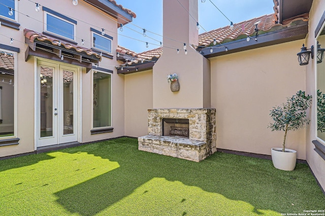 view of patio featuring an outdoor stone fireplace