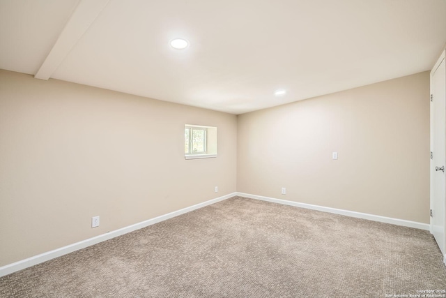spare room featuring recessed lighting, carpet flooring, and baseboards