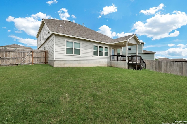 9416 Tennant Ln, Converse, TX 78109 - back of house with roof with shingles, a yard, and a fenced backyard