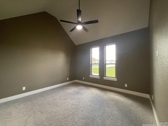 spare room featuring a ceiling fan, baseboards, lofted ceiling, and carpet floors